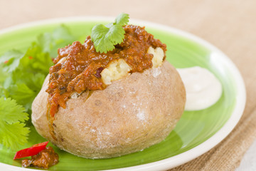 Jacket Potato - Baked potato topped with chilli con carne.
