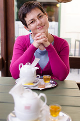 Beautiful young women drinking tea on a porch