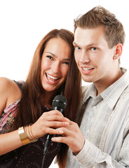 Attractive young couple singing, isolated on white background