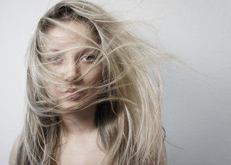 Young woman with long beautiful blond hair