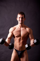 Fototapeta na wymiar young bodybuilder traininig