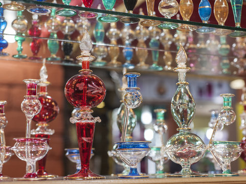 Ornate perfume bottles on a shelf