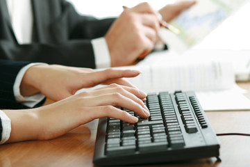 Colleagues working together in office.