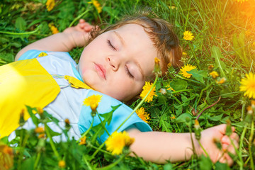 Sleeping boy on grass