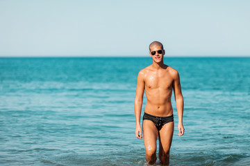 Portrait of men posing at the beach