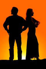 silhouette couple mad arms folded