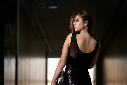 Fashion Model From Behind In Beautiful Black Dress