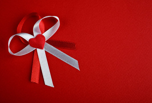 White and red bow with heart