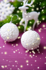 Christmas balls on fir tree, on color background