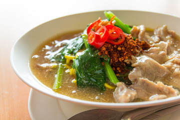 Fried noodle with pork, squid and shrimp soaked in gravy, Chines