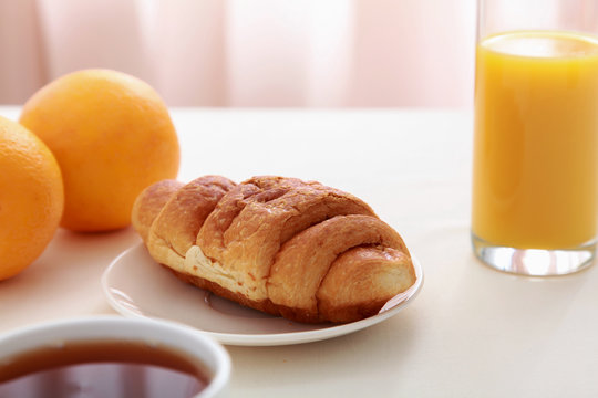 Croissants, coffee, orange juice.