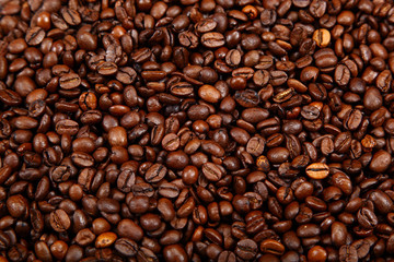 Roasted coffee beans as a background.