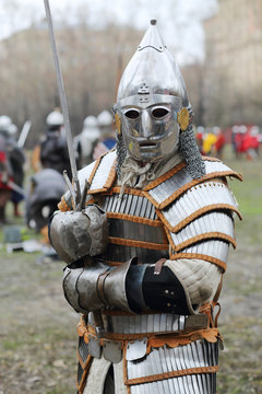 Warrior in armor with sword at Battle