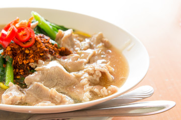 Fried noodle with pork, squid and shrimp soaked in gravy, Chines
