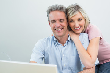 Concentrated content couple using laptop