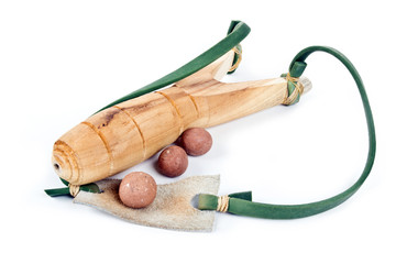 wooden slingshot and clay bullets