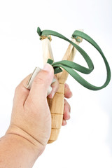 wooden slingshot and clay bullets