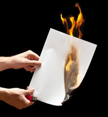 Man hand holding lighter and white burned paper
