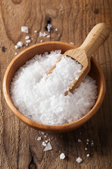 sea salt in wooden bowl and scoop