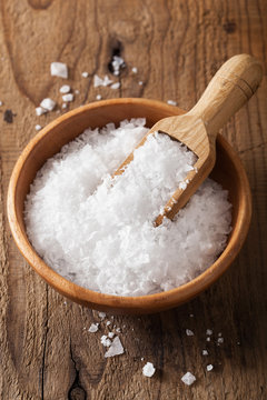 Fototapeta sea salt in wooden bowl and scoop