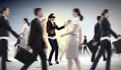 Fototapeta na wymiar Businesswoman in blindfold among group of people