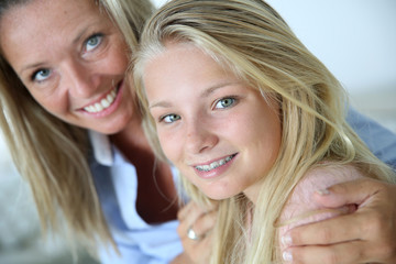 Portrait of mother with teenaged daughter