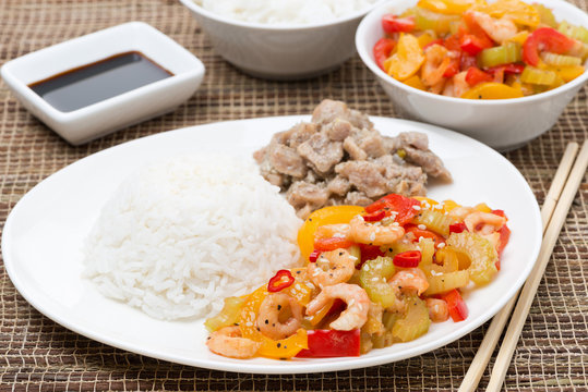 Chinese food - white rice, chicken and vegetables with shrimp