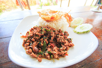 Fried mutton with basil and egg on rice, Thai food