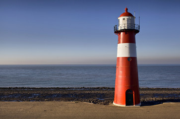 Red-white lighthouse on the coast of North Sea at Westkapelle