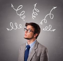 Young man thinking with arrows overhead