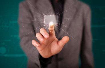 Businessman pressing high tech type of modern buttons