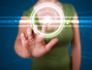 Woman pressing high tech type of modern buttons