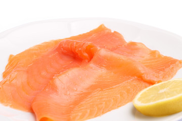 Slices of smoked salmon with lemon