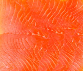 Smoked trout fillet slices as background