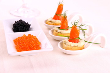 Smoked Lachsrollchen on white bread with caviar