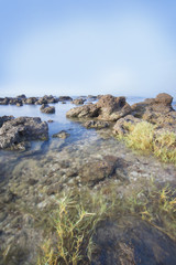 Fototapeta na wymiar Sea and rocky coast in the morning