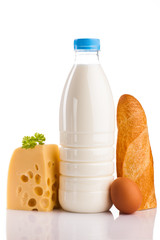 milk bottle with cheese and egg isolated on white