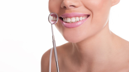 Fototapeta premium Smiling woman showing off her healthy white teeth