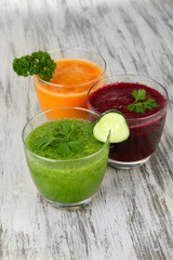 Fresh vegetable juices on table close-up