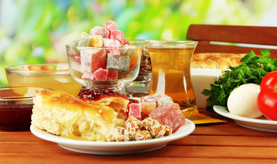 Traditional Turkish breakfast on table on bright background