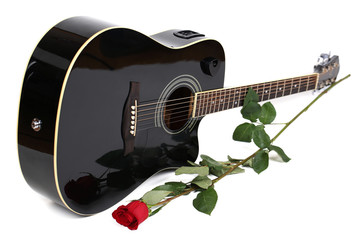 Acoustic guitar and red rose flower, isolated on white