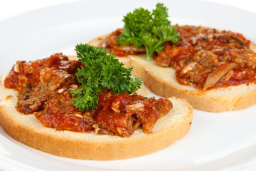 Tasty sandwiches with sardines  and tomato sauce, close-up