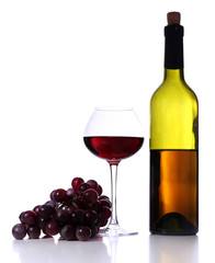 Wineglass with red wine, grape and bottle isolated on white