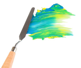 Painting palette knife with paint isolated on white © Africa Studio