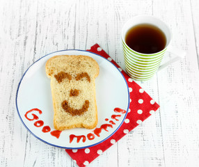 Funny toast, on color wooden background