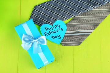 Happy Fathers Day tag with gift boxes and tie,