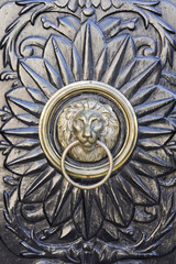 Beautiful decorated door knocker with lion's head