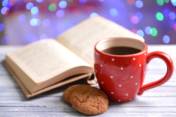 Composition of book with cup of coffee