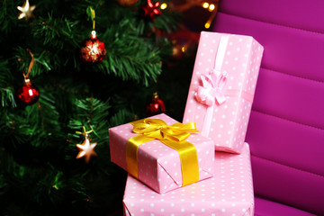 Christmas gift boxes on Christmas tree background