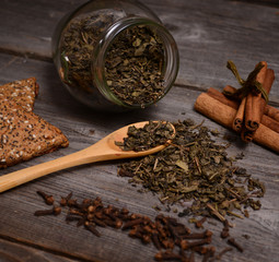 Green Tea, cookies and cinnamon close up